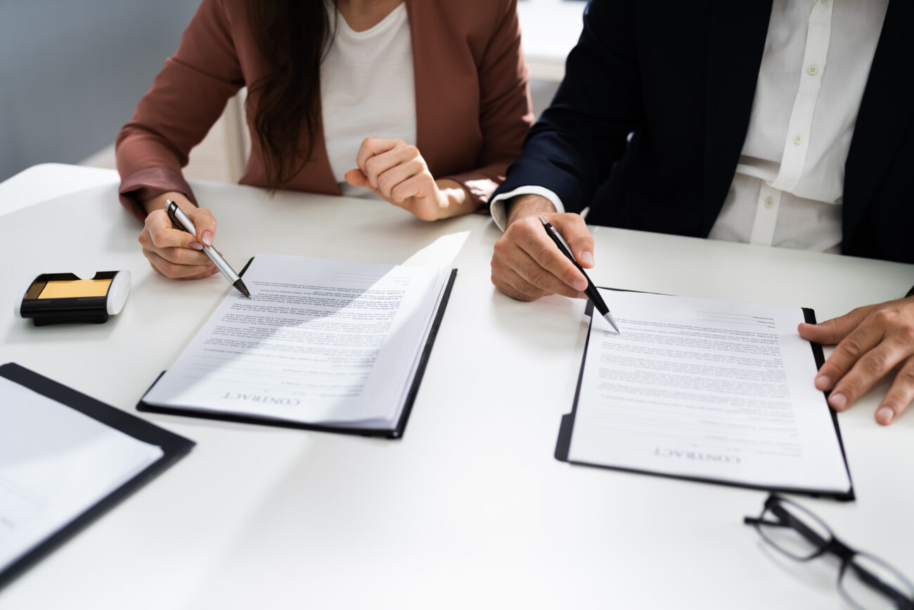 a couple reviewing documents that have come out of their family law mediation